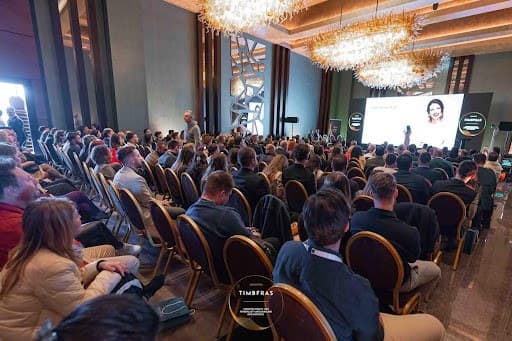 The plenary room of Iulius Congress Hall, full during TIMBFRAS 2025